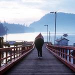 Man Carrying Canoe. Miner's Bay, Mayne Island, Gulf Islands BC.