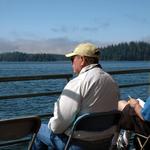 Two Seniors Relaxing And Enjoying The View On A BC Ferry.