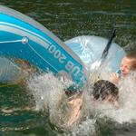 Two Boys In Flipped Over Raft. Paul Lake Near Kamloops, Caribou Region BC.