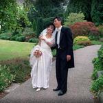 Bride & Groom Strolling Down Path.