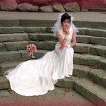 Bride Sitting On Stone Staircase. 