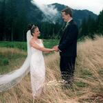 Bride & Groom Enjoying The Moment On Grassy Hill.