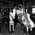 Bride & Groom Riding Carousel.