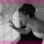 Bride Peaking Through Blinds.