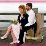 Bride & Groom Relaxing On The Dock.