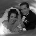 Bride & Groom Relaxing On A Hill.